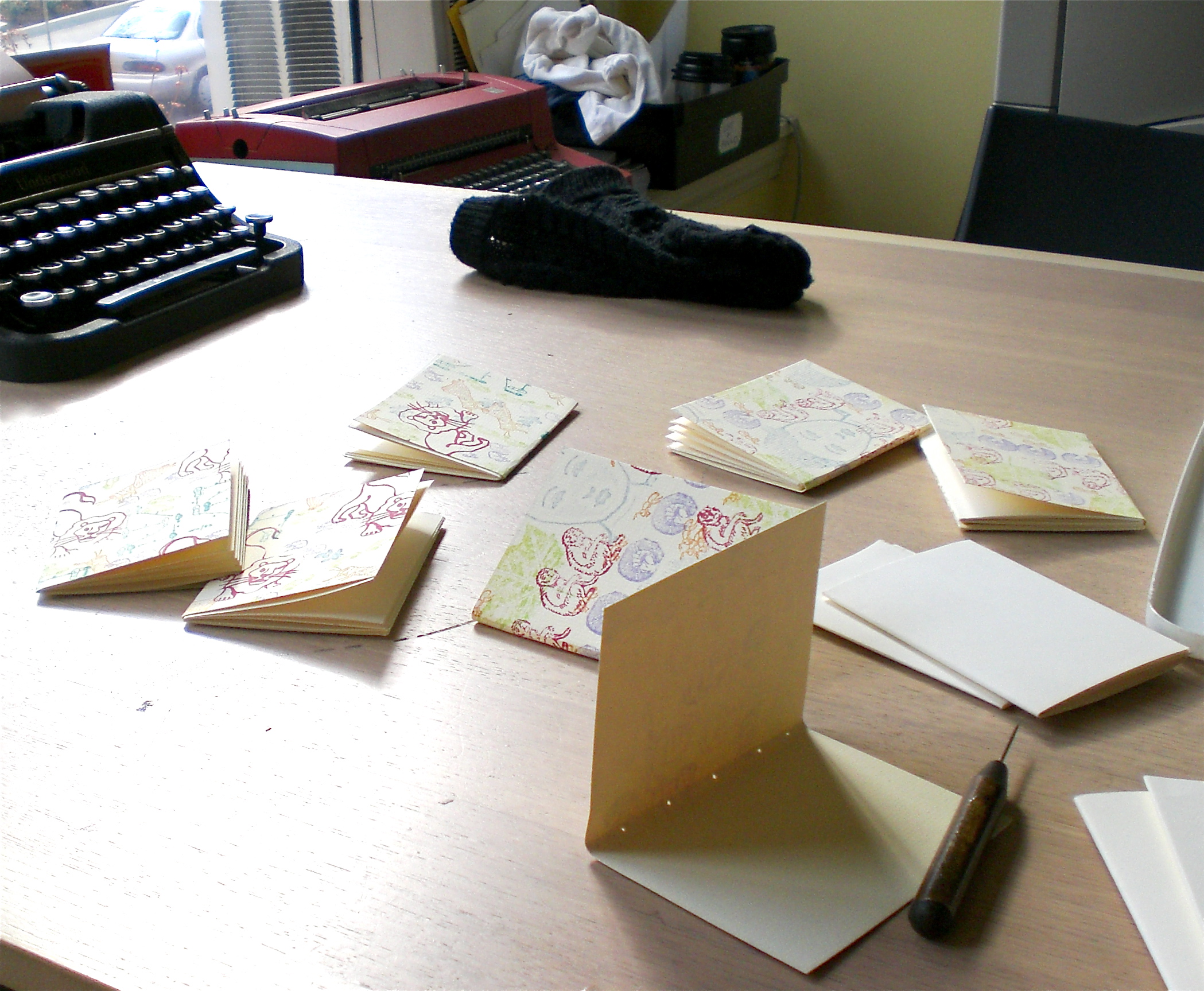 Piercing sewing stations for a hand stamped book made at IPRC