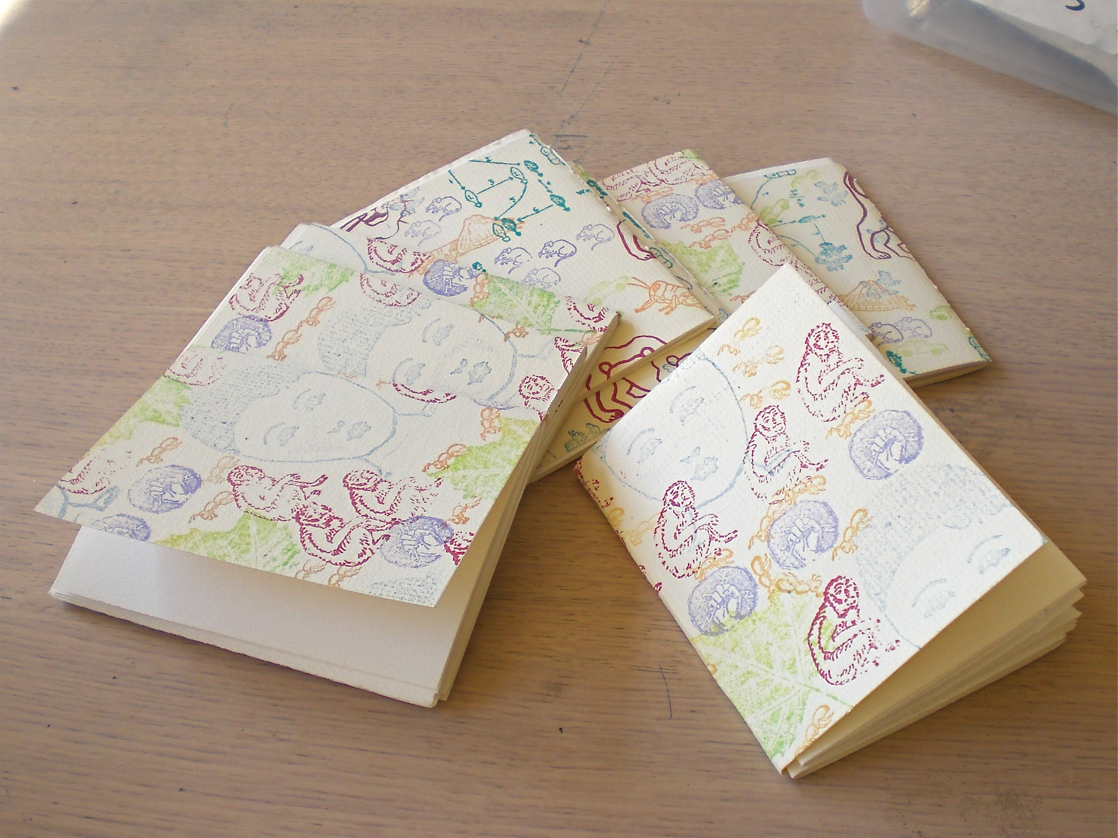 Hand Stamped pamphlet stitch notebooks made at the IPRC in 2009