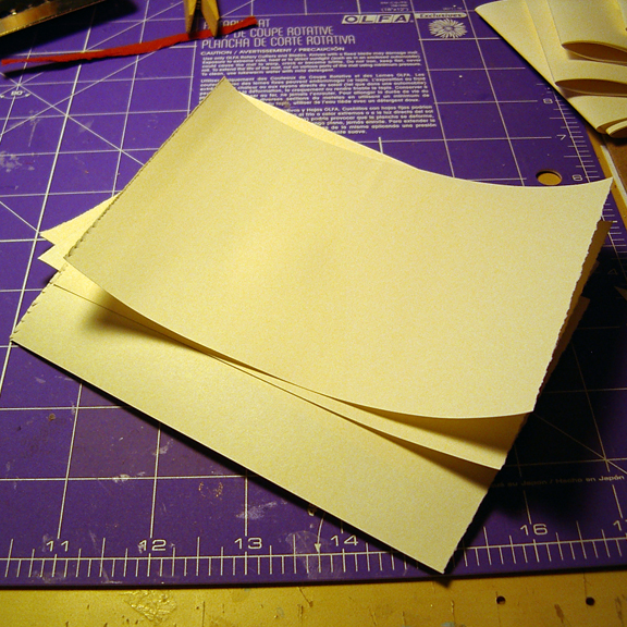 Little Leather Book made by Ruth Bleakley - Here are some pages stacked and ready for folding