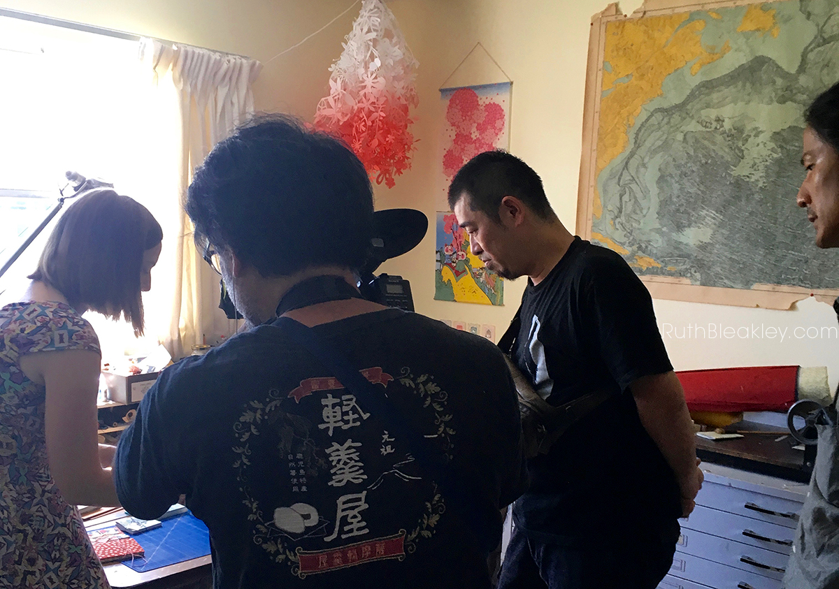 Ruth Bleakley in the studio demonstrating watoji bookbinding for Japanese TV