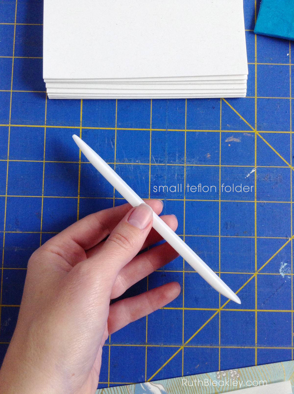 Teflon folder side view - essential bookbinding tool