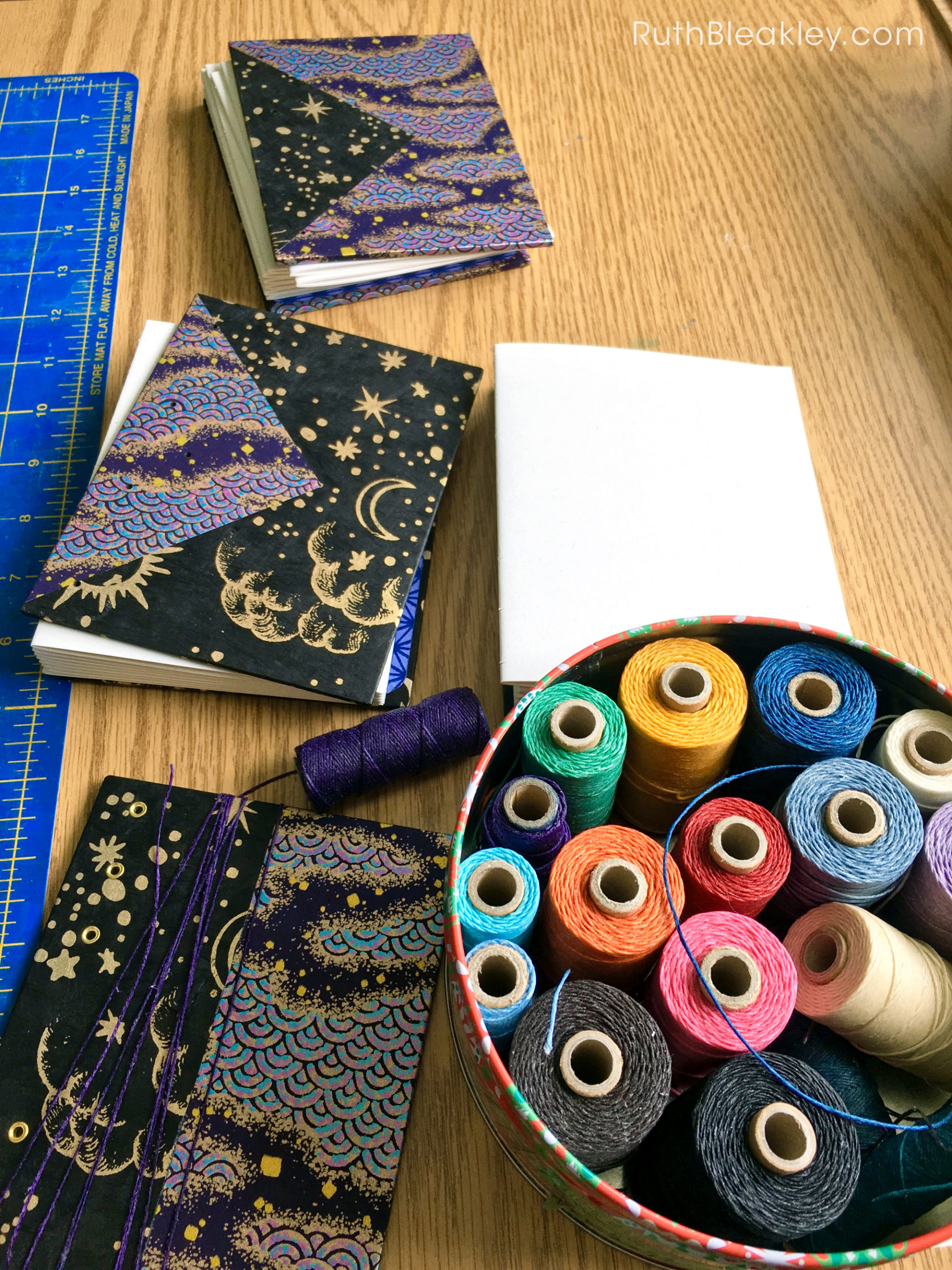 a view of book artist studio with thread choices