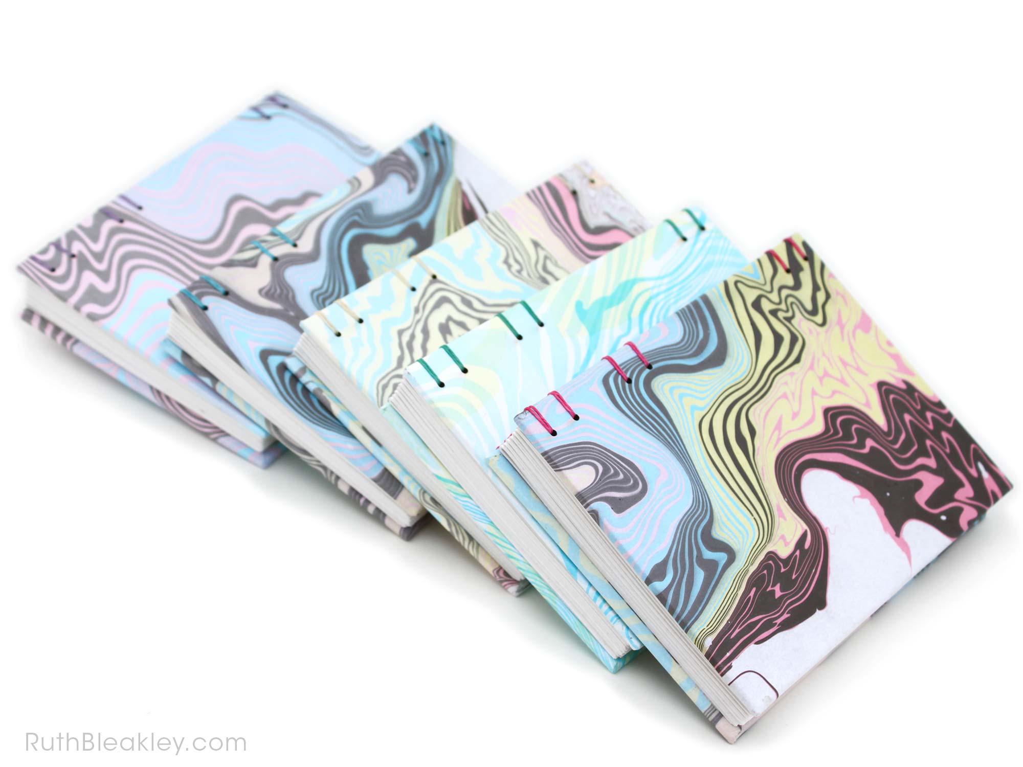 Stack of Suminiagashi Marbled Journals handmade by bookbinder Ruth Bleakley 4